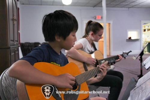 Students, kids like to learn guitar, ukulele in Rob's Guitar School Groton, MA