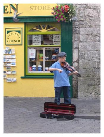 Dermot Creegan in 2005 plays on the streets of Galway while his parents have a pint ....just the one, mind you.
