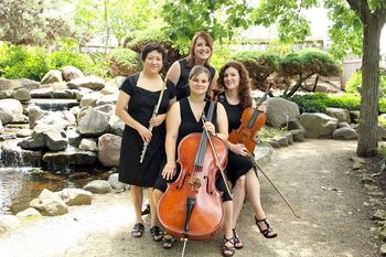 Arbor Ensemble at Janesville Rotary Gardens.  Standing from left to right, Berlinda Lopez (flute), Stacy Fehr Regehr (piano).  Seated from left to right, Rebecca Riley (cello), Marie Pauls (viola).  Photo courtesy of Marsha Mood Photography.
