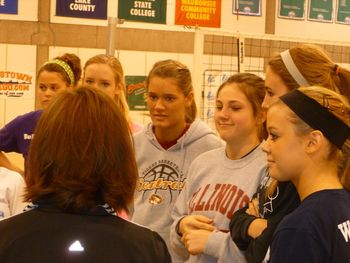 Coach Holder talking girls through warm ups
