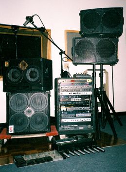 old Eden bass cabs, 2x12"s on stands, IVP rack
