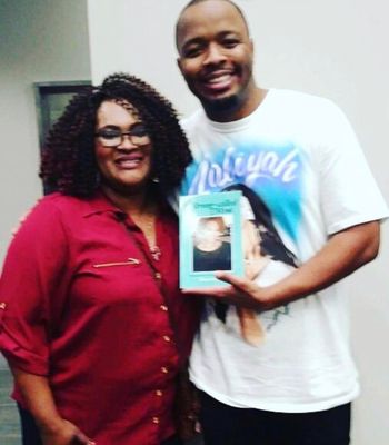 Comedian, KevOnStage with my Poetry Book
