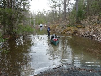 I've travelled to gigs a lot of different ways... cars, vans,buses, planes and trains but this was a first. To traverse our flooded road, I had to load all my equipment into a canoe! I guess this is how the Voyageurs used to get to their gigs.

