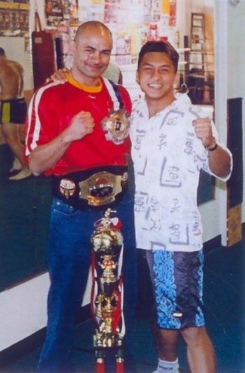 Coach Ron with pro fighter and W.K.A. and muay thai world champion Melchor Menor
