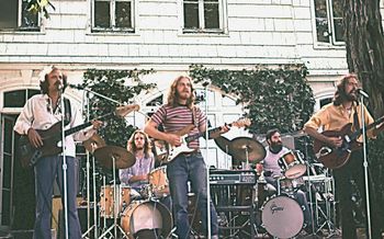 The Skydogs at Friends World College, about 1976. Left to right: Wayne Brusseau (bass), Scott Kistenberger (drums), Stephen Ramirez (guitar), Bill Grillo (drums), Douglas Baldwin (guitar). The Skydogs formed around 1974 with Keith Macken taking the guitar/vocal chair that Stepen holds in this picture. That original lineup was called Scott Calder and the Skydogs, in honor of our soundman. Previously, I had played with Scott Kistenburger in every band since fourth grade, when we lip-synched to Beatles and Beach Boys records in my garage (admission 5 cents). I had also played with Bill Grillo and Keith Macken around '71-'72 in Calder's Circus. In addition to Bill, Keith and myself, Calder's Circus featured Jimmy Haslip on bass. That was an honor.
