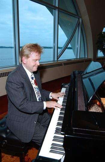 Jay Isaacson plays piano for a corporate party at Monona Terrace, Madison, Wisconsin.
