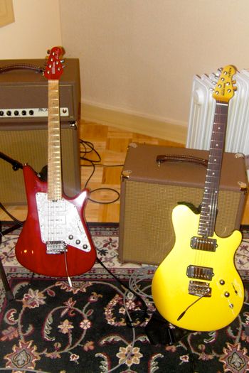My two Ernie Ball Music Man guitars and my Funk Farm MO Twin 25 amp

