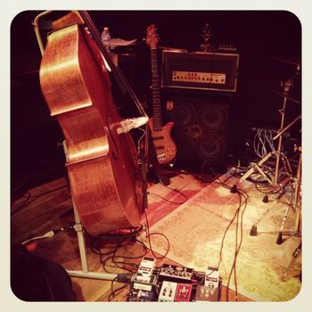 Stage shot of my road gear: Chadwick Folding Upright Bass, Crews Electric 5-string, Eden WT-800 & 4x10
