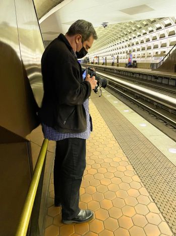 Director Arlin Godwin about to shoot Jane Smith aboard a Washington, DC metro train
