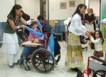 Dancing with the children in another hospital.
