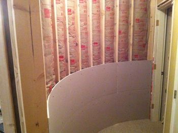 2 layers of thin drywall going on curved wall
