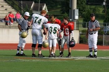 Paul ( #74 ) is a little larger than the other captains - and the referees.
