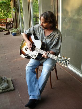 Playin’ it softly at my mom’s house in her wooded hideaway just outside of Sturgis, Michigan.  Photo by Aphrodite Rawlings
