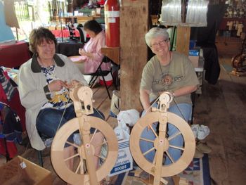 Pat McKinney and Sue Shoop spinning llama fiber

