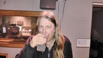 Danny refreshes his voice box before unleashing primal fury on an unsuspecting KGNU audience, 2-13-2012.
