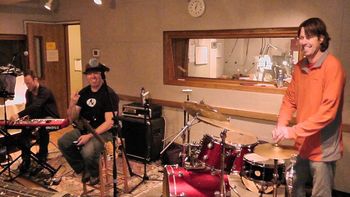 Dechen, Jubal and Todd setting up for a live broadcast from KGNU radio station, Boulder, CO.
