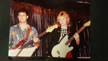 Howard Leese ( Heart, Bad co. ) and me at the release party/concert for Dick Dale's " The Tigers Loose record, recorded live at the Golden Bear with the Wally Heider remote studio/truck. Early 1980s. Howard is playing a custom Strat I built ( pre- Fender Custom Shop ) and I have my '64 Fender Candy Apple Red Precision Bass
