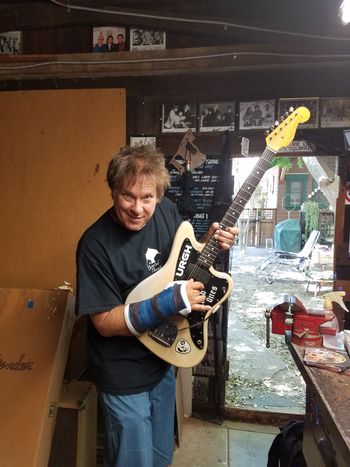 MIke Palm ( Agent Orange) with his Fender Jaguar in the shop for some setup work. Notice his arm cast... sometimes skateboarding and guitar playing don't mix well.
