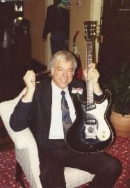 Semie Moseley (Mosrite) holding my Ventures model prototype in the lobby of the Anaheim Marriott hotel during a NAMM trade show around 1991-92. He told me he hand made it in his kitchen at his home on Panama Lane in Bakersfield, Ca.
