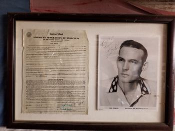 a signed photo and engagement contract from Carl Perkins.
