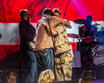 The Hugs seen around the world! Blessed to be on stage with my Comrades & Music Family!
