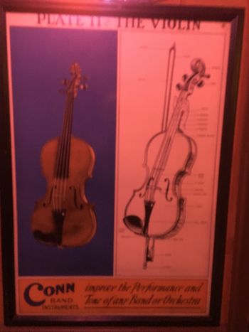 On the left hand side of the image is an actual violin. The right hand side of the image is a drawing.
