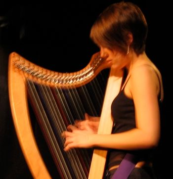 Sahra playing her harp with Lila Rose at the Cameron House, Toronto, Ontario, 2008
