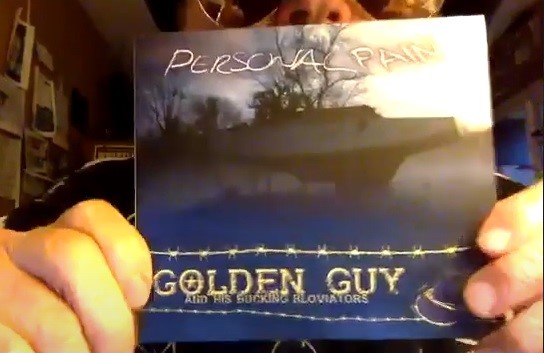 Golden Guy holding his new album Personal Pain on CD