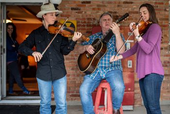 Champion fiddler Ridge Roberts, fiddling legend Joey McKenzie, and Marina enjoy a beautiful afternoon playing Bob Wills tunes in Burleson, Texas.