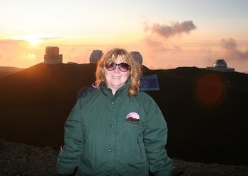 On top of Mauna Kea at sunset, freezing but happy.
