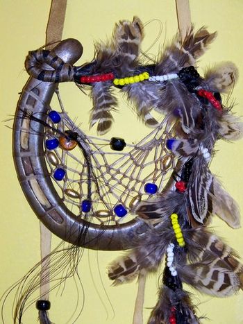 Close up of Ouke 313's dream catcher. Hair on left is Ouke's, and hair on right was his son who died in 2010 as a foal. I braided the hair to give it a long tail.
