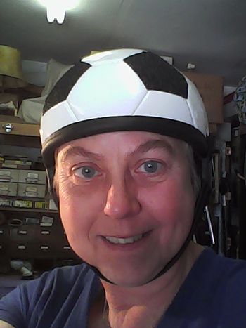 Set of soccer ball hats.  Television commercial.
