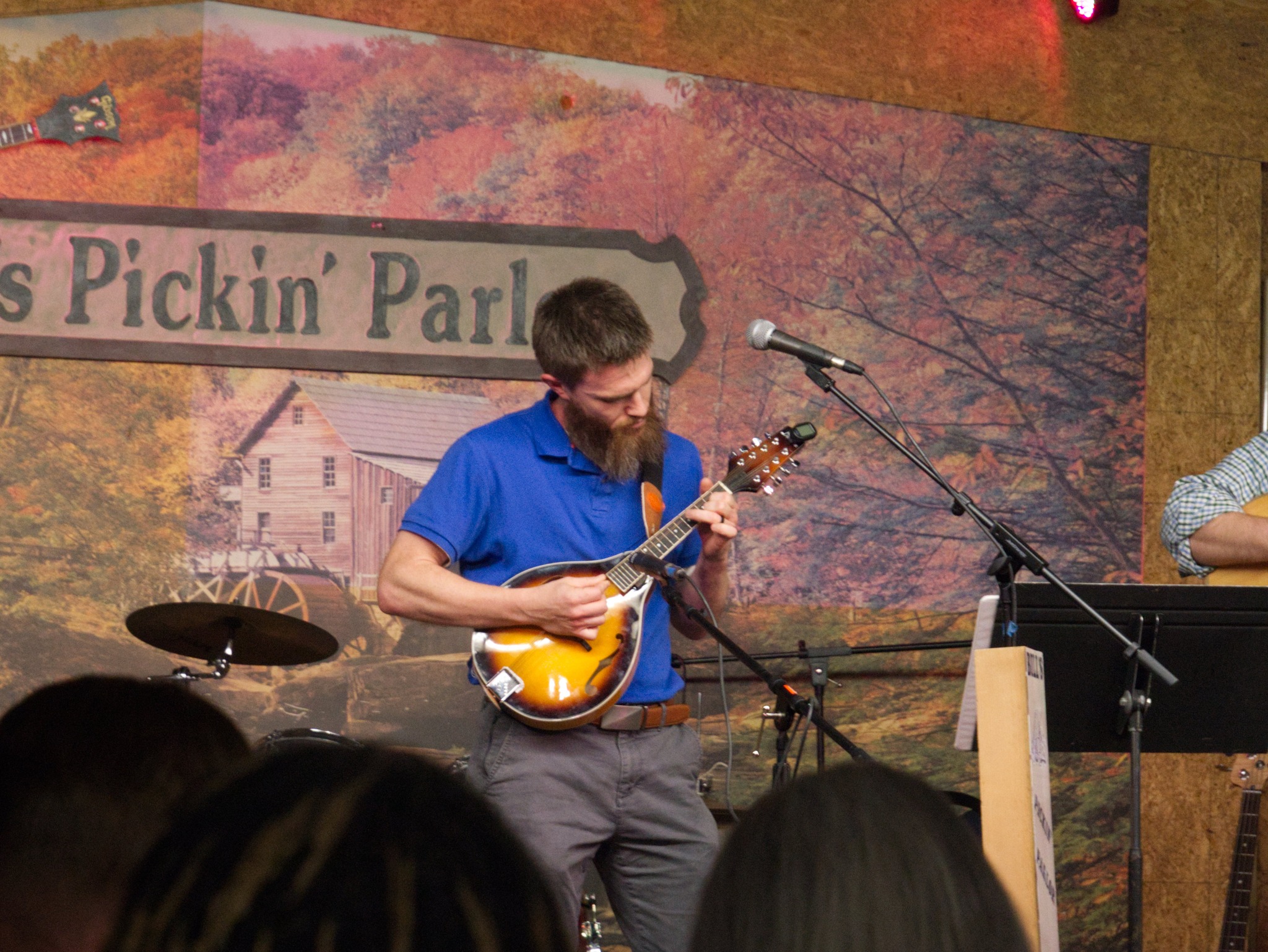 Jim performing with a mandolin student