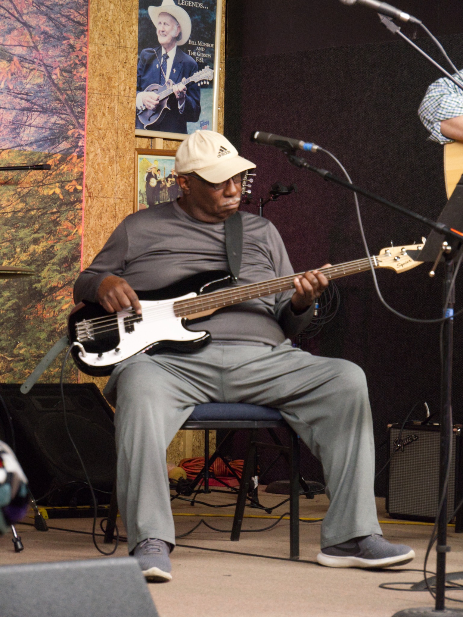 Jim performing with a bass student