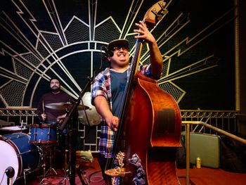 Joaquin Ruiz of Bigfoot And The Moon playing upright bass at Howlin Wolf in Fresno Ca
