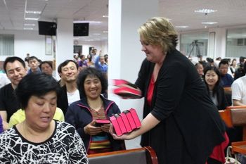 Anita giving Bibles in China
