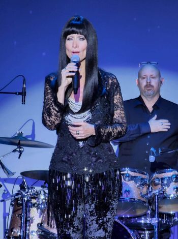 Lisa Irion as Cher encore performance of Cher Superbowl version of National Anthem
