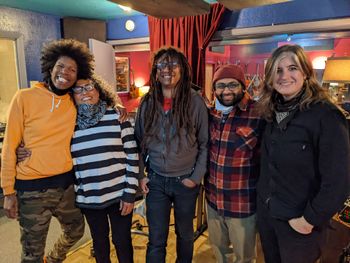 The band Skip The Needle (L-to-R: Kofy Brown, Vicki Randle, Shelley Doty, and Katie Cash) with Uncaged Library artistic director Anand Kalra during a break between takes.
