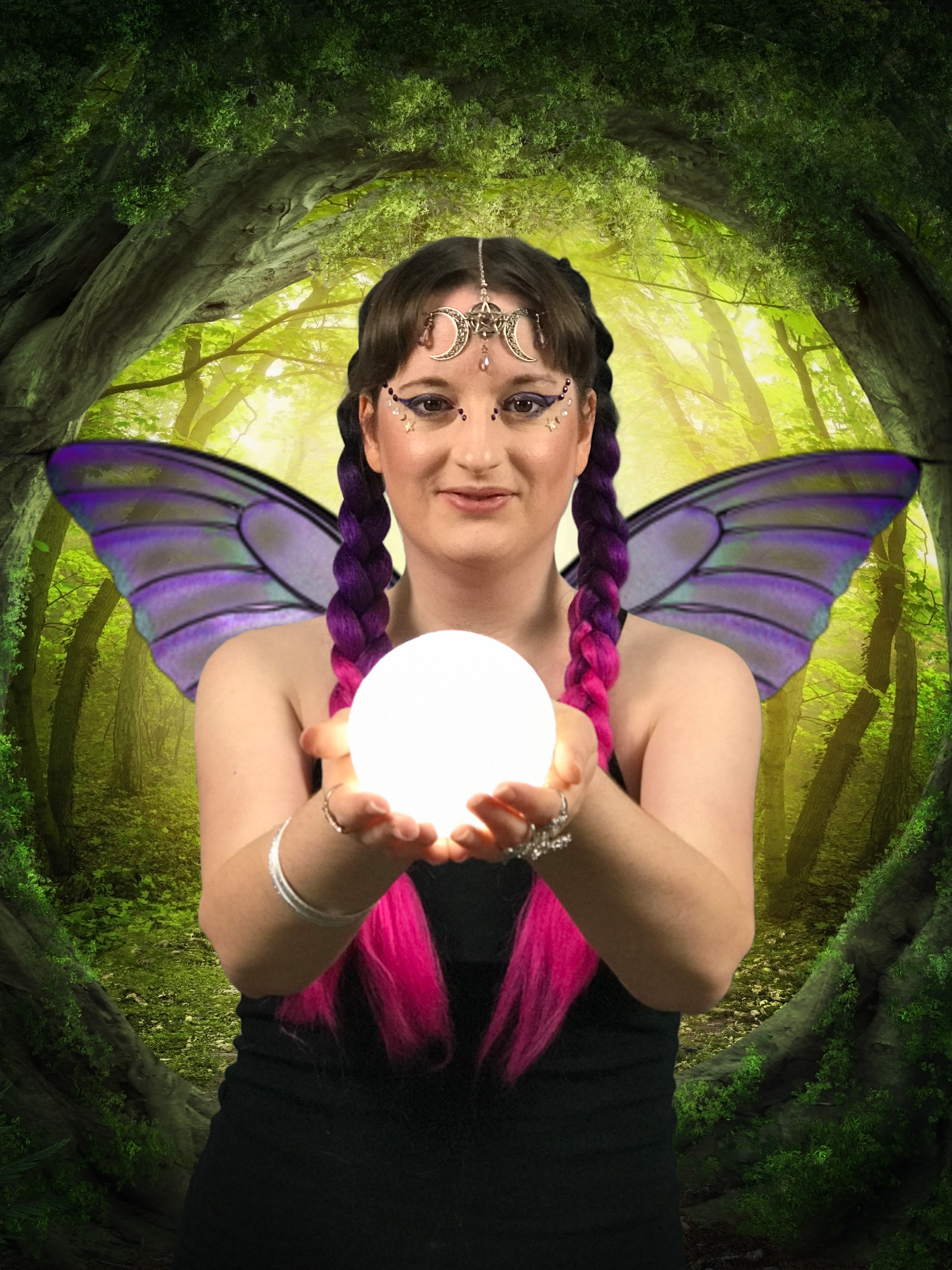 Livia in a forest with fairy wings and a crystal ball