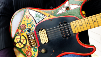 Jon's famous customized guitar. It was decorated with paint, tile, mirrors, and other trinkets by his friend and former IOSIS band mate Scott Summers.
