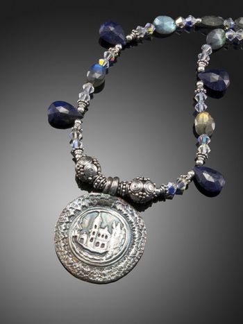 Castle Rock - Fine silver layered pendant using a vintage button texture. Necklace of Labradorite and blue Sapphires.McKenzie's Jewelry by Nancy Koehler. SOLD
