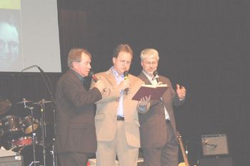 The Heritage Boys sing out of the red book.
