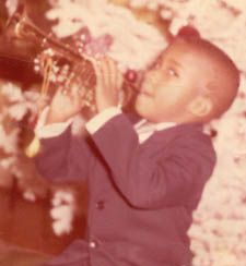 Bill McGee with play trumpet at 7 years old

