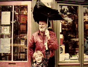 Lawrence Ferlinghetti & young Sylvia Whitman in Paris 1981 in front of Shakespeare & Co. Book Shop
