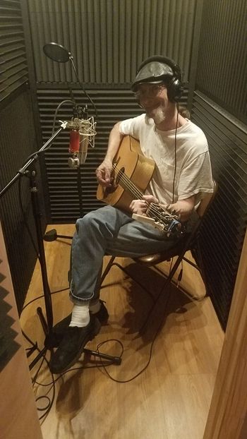 Tom Griffin tracking guitar in the booth.
