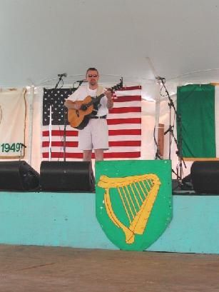 Mark onstage scaring the soundman! CT Irish Festival - photo Bob Sagendorf
