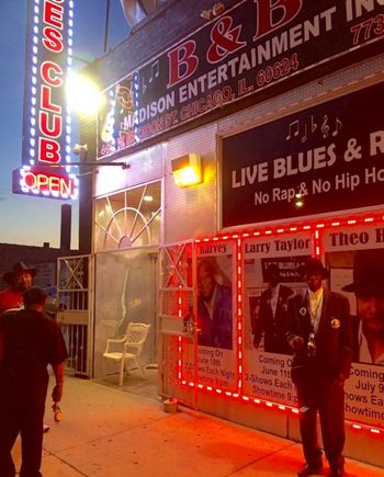 B_B_Larry_Night_outside Night time on the West Side; Larry with his own poster outside B&B club, 2016
