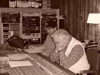 Lynn at the Control / Mixing Board with Robby Meadows, Engineer and Studio Bass Player, Listening to a Play Back.