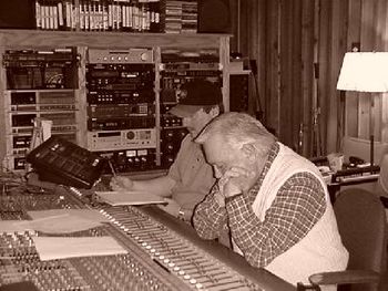 Lynn at the Control / Mixing Board with Robby Meadows, Engineer and Studio Bass Player, Listening to a Play Back.
