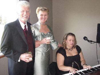 Dennis and Jan Petersen with Holly at their wedding reception
